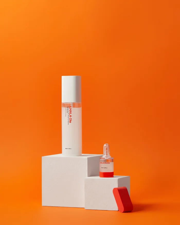 LHALA Ole and a LHALA Doctor ampoule on the brand orange
